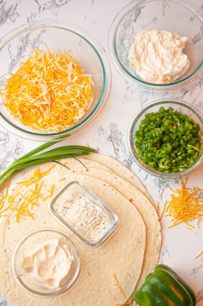 Ingredients for this recipe: tortillas, green onions, cheese, green peppers, mayo & ranch seasoning