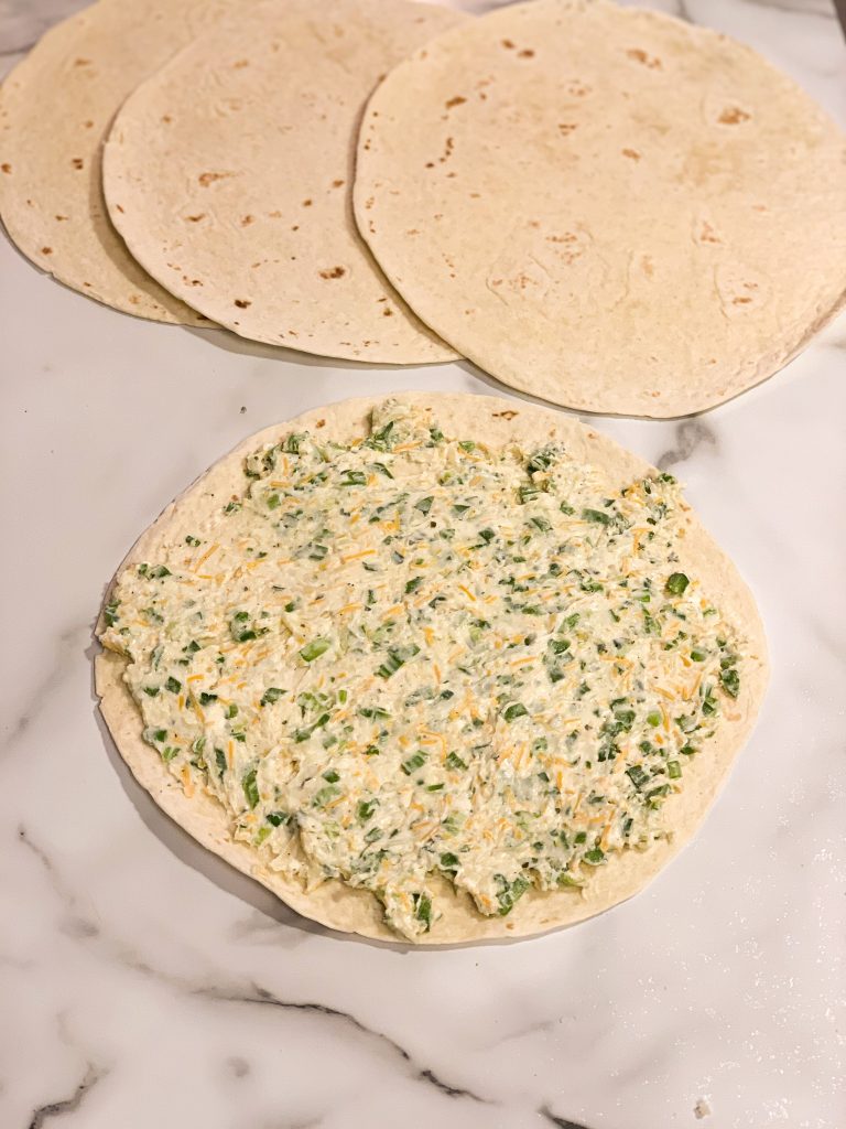 Mixture spread out on tortilla 