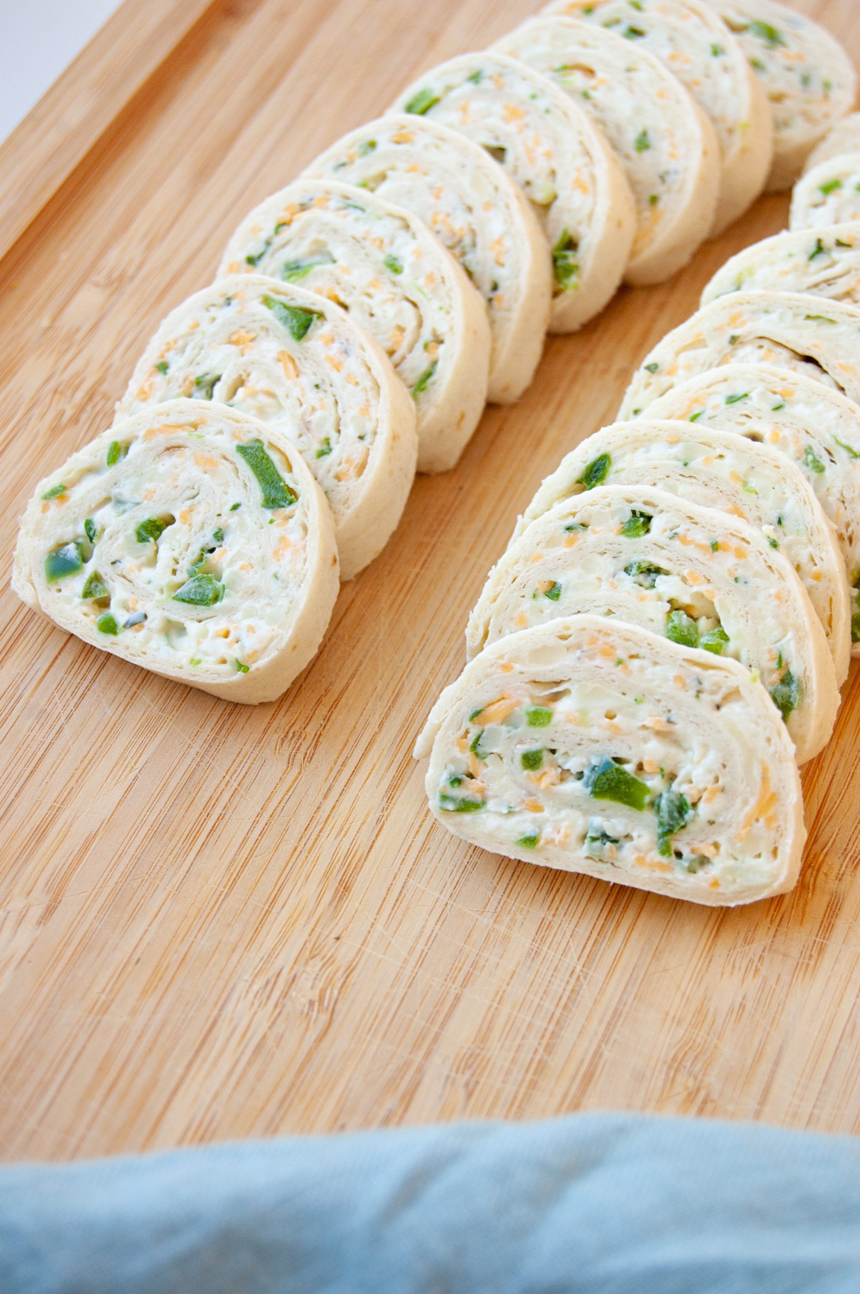These Ranch Cream Cheese Rollups are an easy and delicious appetizer for any party! Great to make ahead and just a few simple ingredients. Whether you call them rollups or pinwheels, these are bound to be a family favorite for years to come!