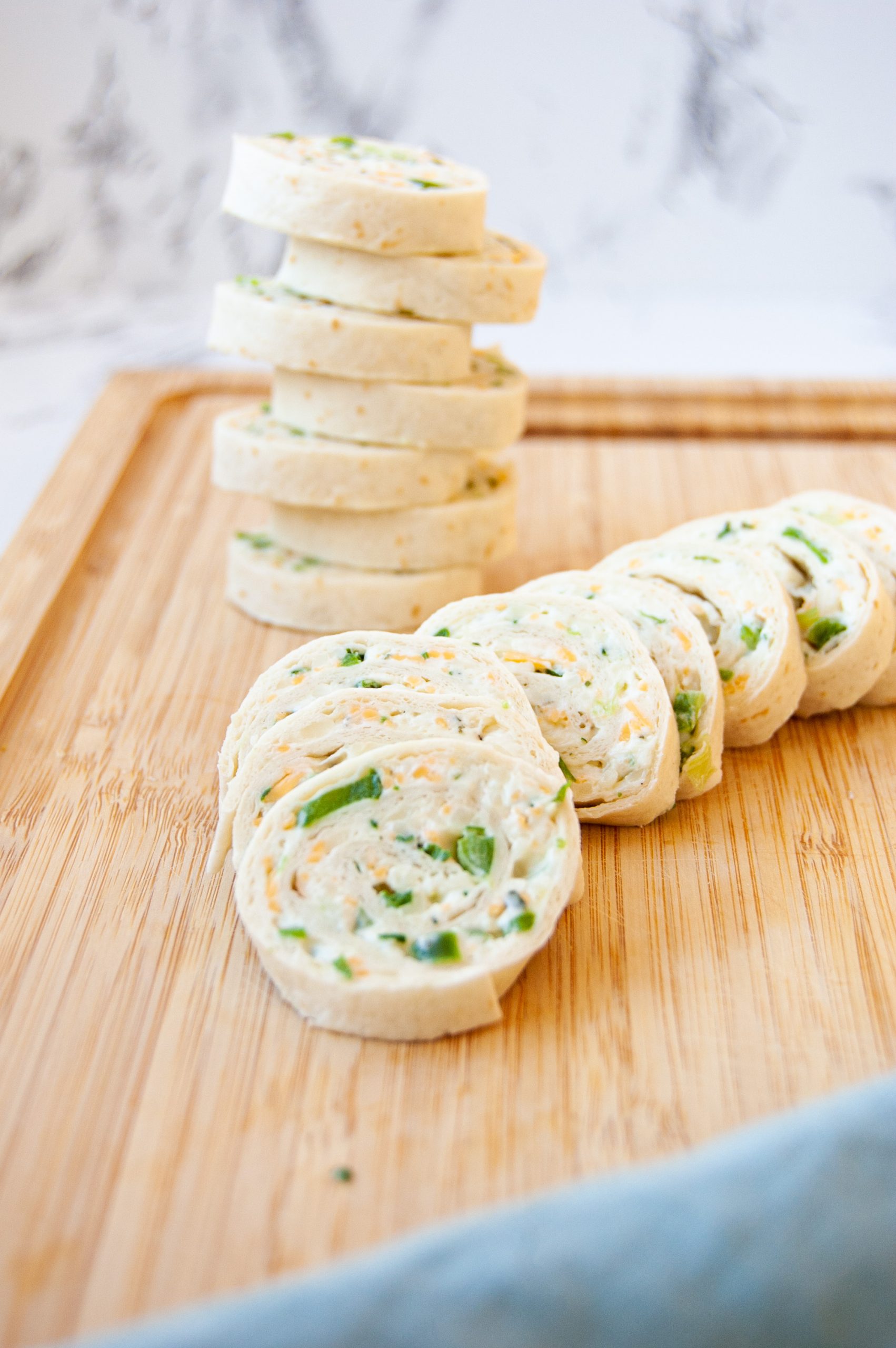 These Ranch Cream Cheese Rollups are an easy and delicious appetizer for any party! Great to make ahead and just a few simple ingredients. Whether you call them rollups or pinwheels, these are bound to be a family favorite for years to come!