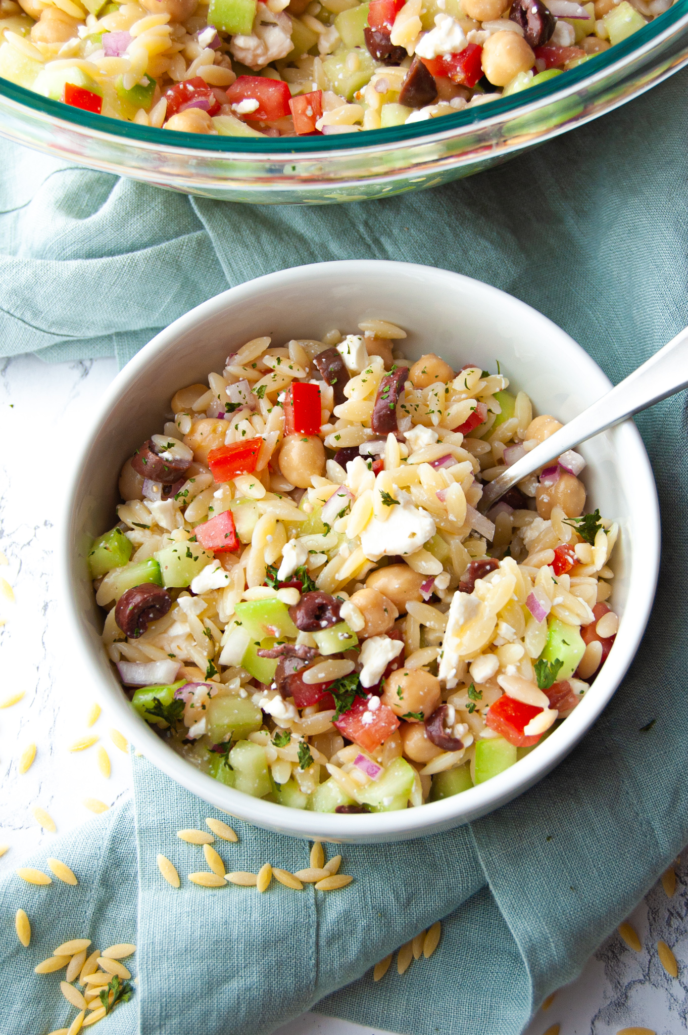 This Easy Summer Orzo Pasta Salad will soon be a family favorite! A quick 15 minutes and you have a fresh and cool side dish for any summer BBQ or get-together!