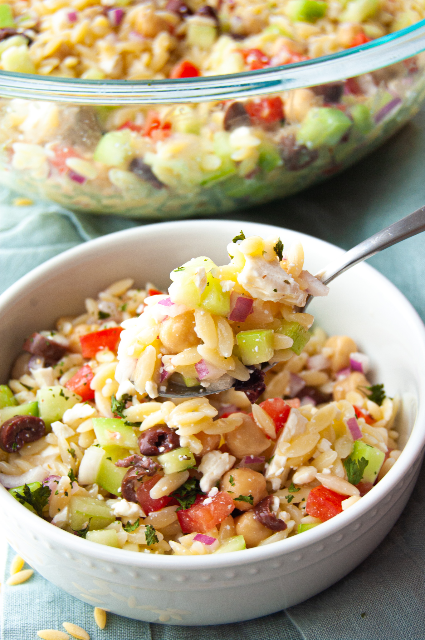 This Easy Summer Orzo Pasta Salad will soon be a family favorite! A quick 15 minutes and you have a fresh and cool side dish for any summer BBQ or get-together!