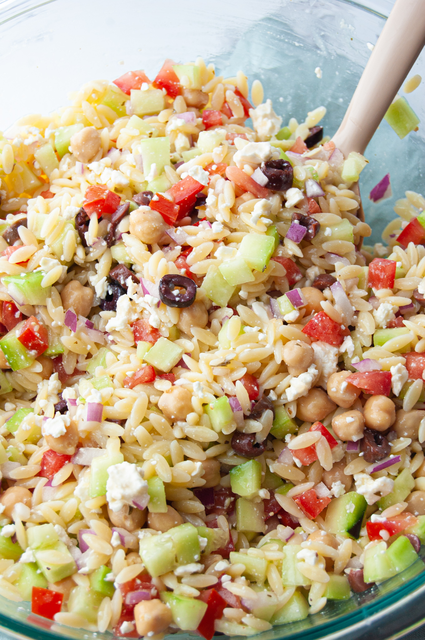 This Easy Summer Orzo Pasta Salad will soon be a family favorite! A quick 15 minutes and you have a fresh and cool side dish for any summer BBQ or get-together!